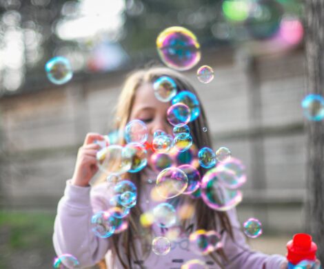 person holding bubble during daytime